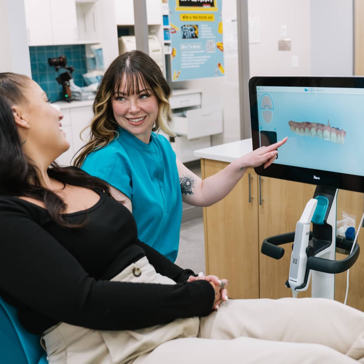 teen boy smiling with team member