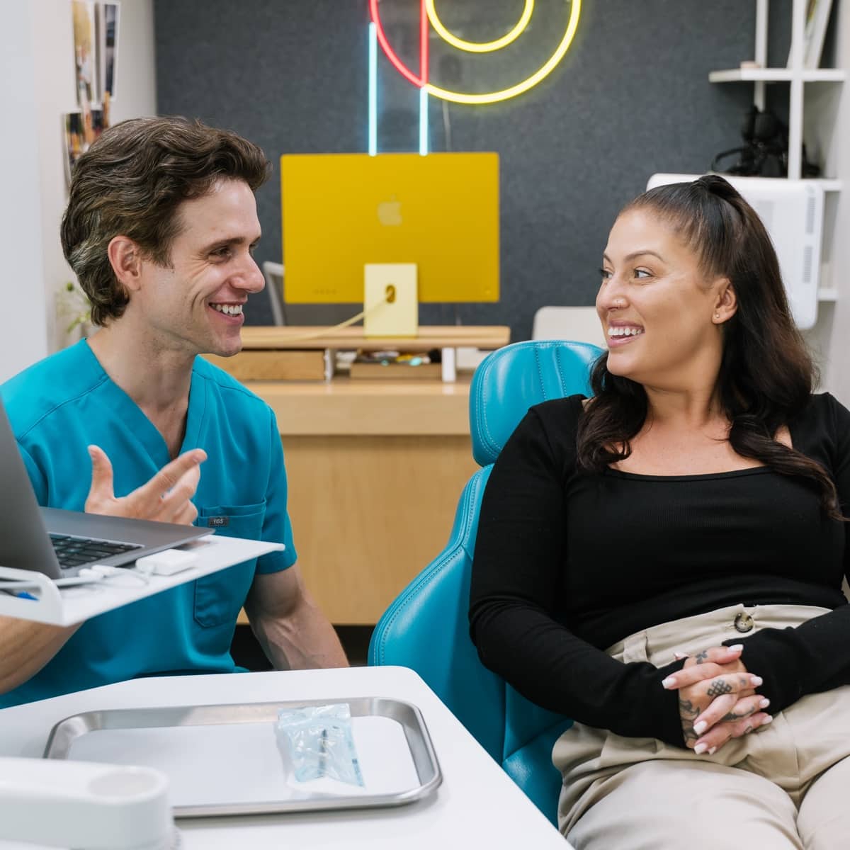 teen boy smiling with team member